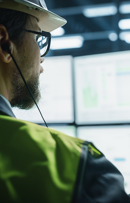 Worker inspecting bolts