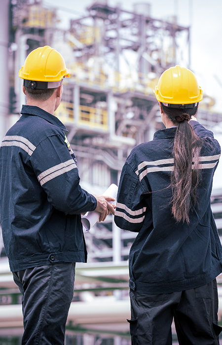 Worker inspecting bolts